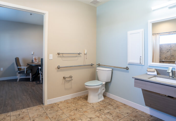 Accessible Bathroom With Grab Bars Toilet and Sink Area at Memory Care Facility Accessible Bathroom With Grab Bars Toilet and Sink Area at Memory Care Facility