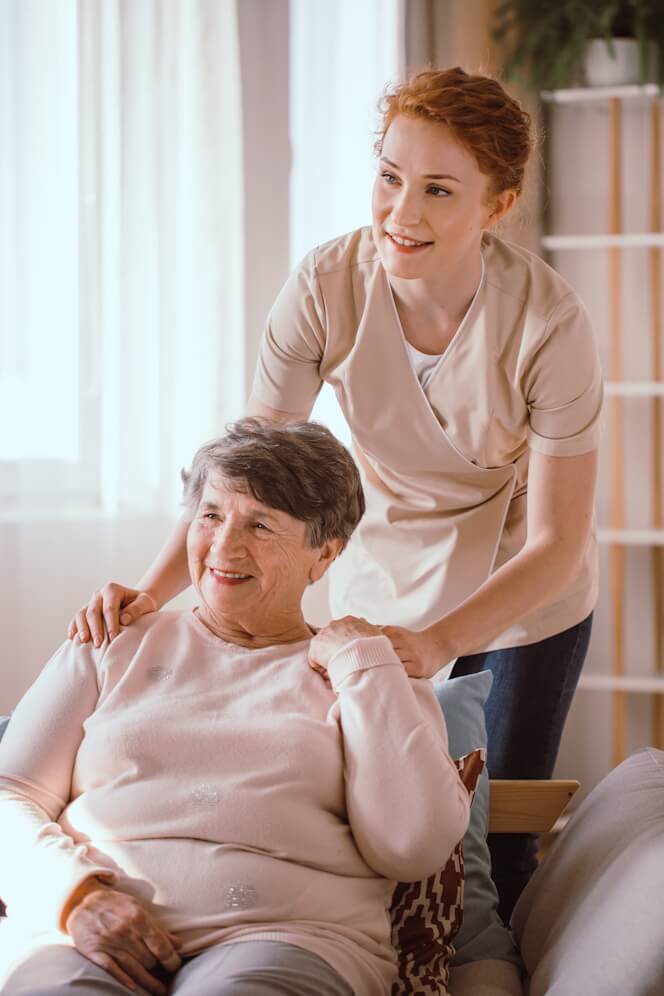 caregiver-supporting-smiling-senior-woman caregiver-supporting-smiling-senior-woman