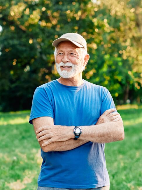 Elderly Man Smiling at Nursing Home in Colleyville partner-with-us-for-seamless-patient-transitions